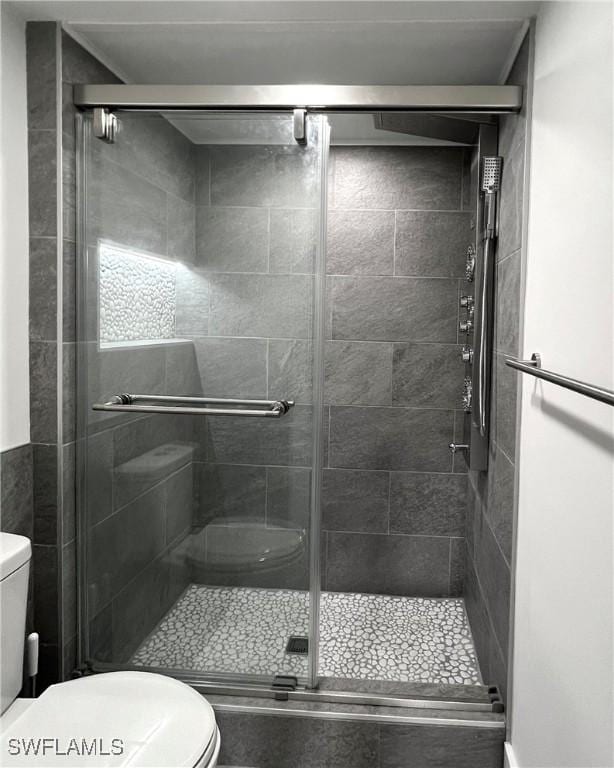379 Gabriel Cir Unit 2309, Naples, FL 34104 - full bath with toilet and a stall shower