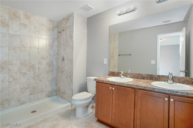 1821 SW 25th St, Cape Coral, FL 33914 - bathroom featuring a sink, a tile shower, double vanity, and visible vents