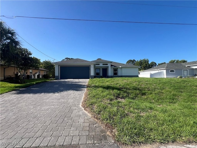 single story home with an attached garage, decorative driveway, a front lawn, and stucco siding