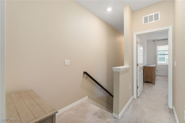 stairs with baseboards, carpet flooring, and visible vents