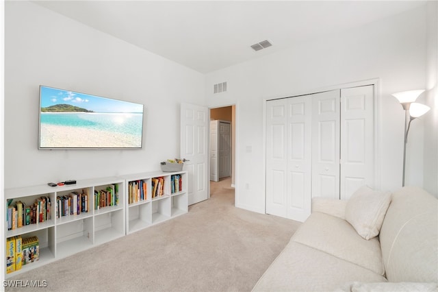 living room featuring carpet and visible vents