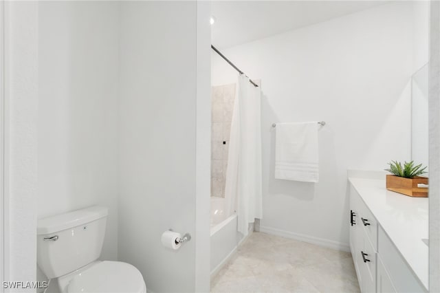 bathroom featuring toilet, vanity, shower / bath combo, tile patterned flooring, and baseboards