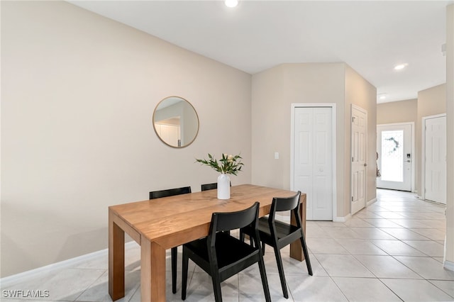dining area featuring baseboards, light tile patterned flooring, and recessed lighting