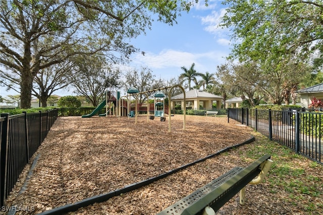 communal playground featuring fence