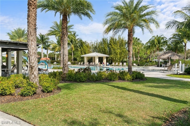 view of property's community with a gazebo, a swimming pool, and a lawn