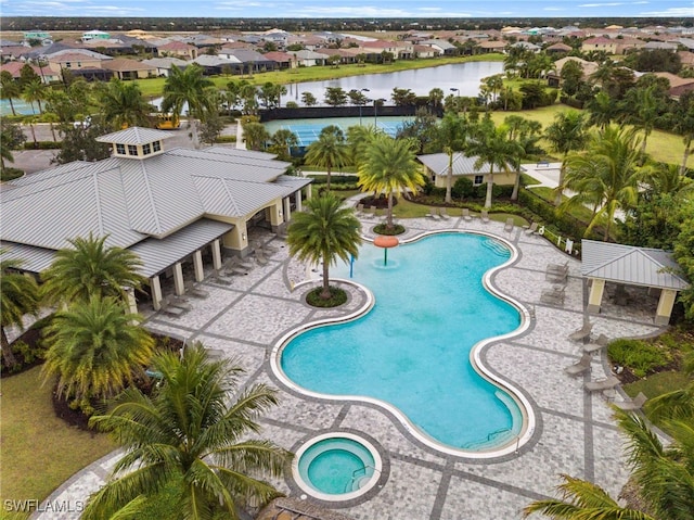 pool featuring a water view and a residential view