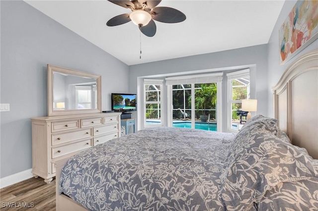 bedroom featuring access to outside, ceiling fan, baseboards, wood finished floors, and lofted ceiling
