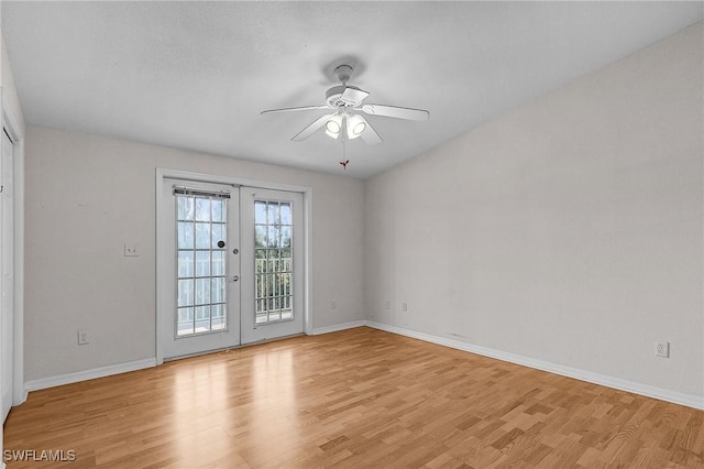 empty room featuring ceiling fan, light wood-type flooring, french doors, and baseboards