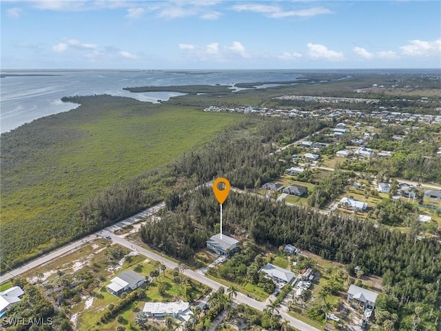 aerial view of property's location featuring a nearby body of water