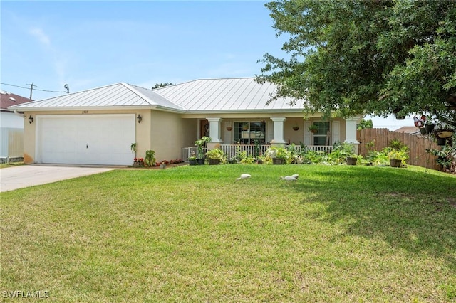3303 32nd St SW, Lehigh Acres, FL 33976 - ranch-style home featuring a porch, an attached garage, concrete driveway, a standing seam roof, and stucco siding