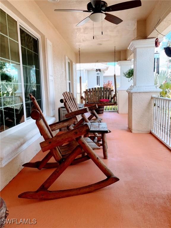 3303 32nd St SW, Lehigh Acres, FL 33976 - view of patio featuring ceiling fan