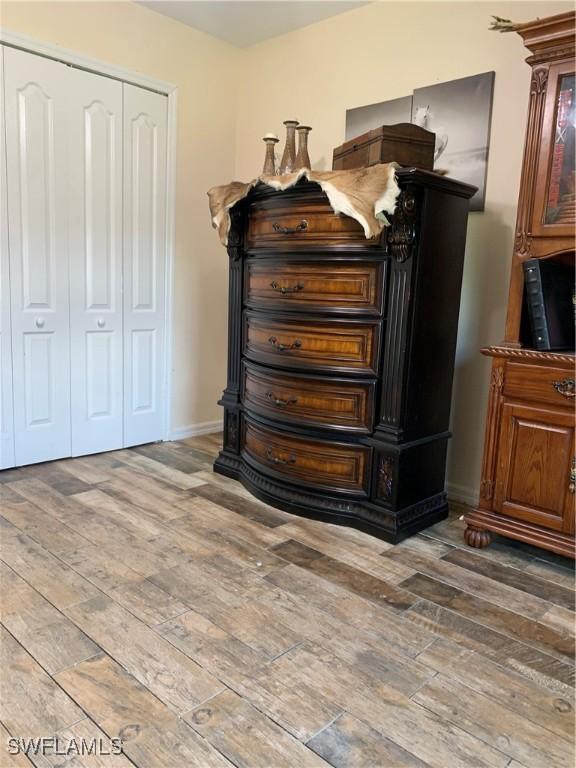 3303 32nd St SW, Lehigh Acres, FL 33976 - detailed view of wood finished floors and baseboards