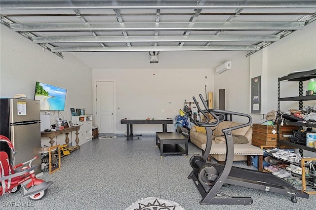 3905 15th St W, Lehigh Acres, FL 33971 - garage with freestanding refrigerator, an AC wall unit, and electric panel