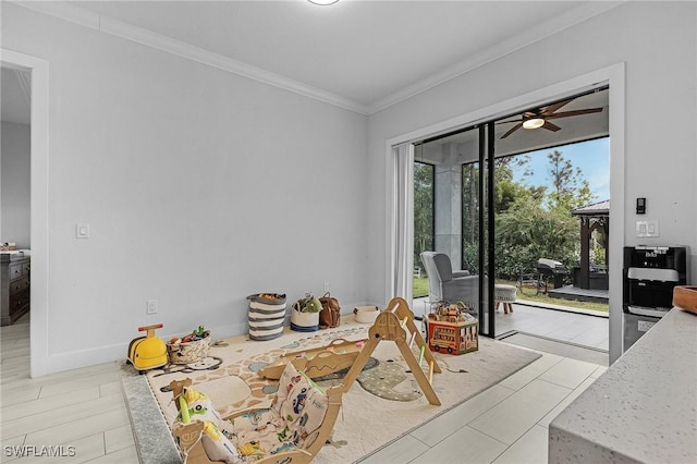 dining area with crown molding and ceiling fan