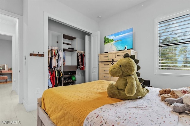 bedroom with a closet and a spacious closet
