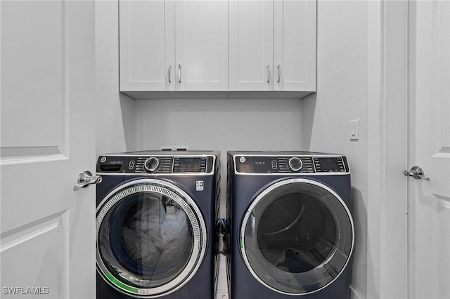 laundry area with washing machine and dryer