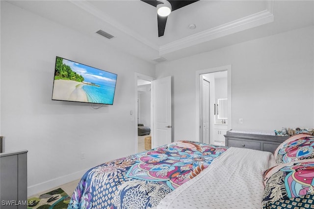 bedroom featuring a ceiling fan, baseboards, ensuite bathroom, visible vents, and ornamental molding