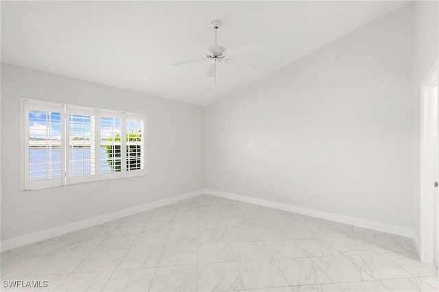 2524 Sailors Way Unit 118, Naples, FL 34109 - empty room with a ceiling fan, baseboards, vaulted ceiling, and marble finish floor