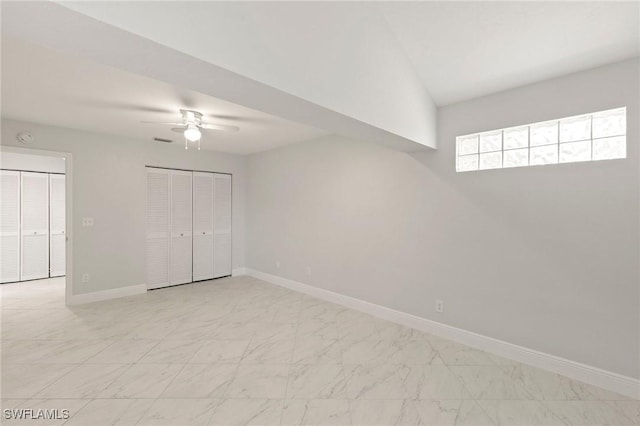 2524 Sailors Way Unit 118, Naples, FL 34109 - unfurnished bedroom featuring a ceiling fan, visible vents, baseboards, a closet, and marble finish floor