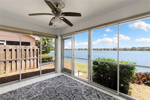 2524 Sailors Way Unit 118, Naples, FL 34109 - unfurnished sunroom featuring a water view and ceiling fan