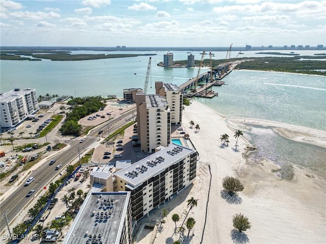 drone / aerial view featuring a water view and a city view