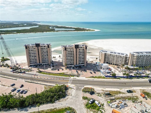 birds eye view of property featuring a view of city and a water view