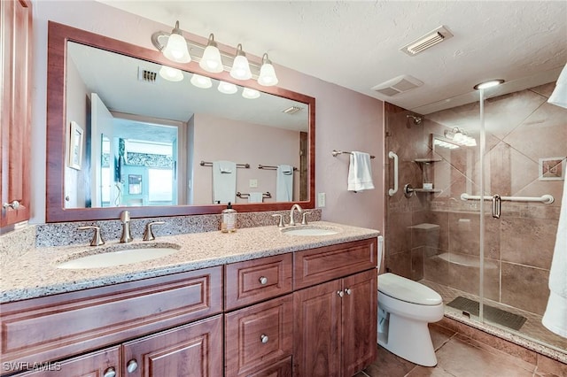 full bath featuring tile patterned floors, visible vents, a sink, and a stall shower