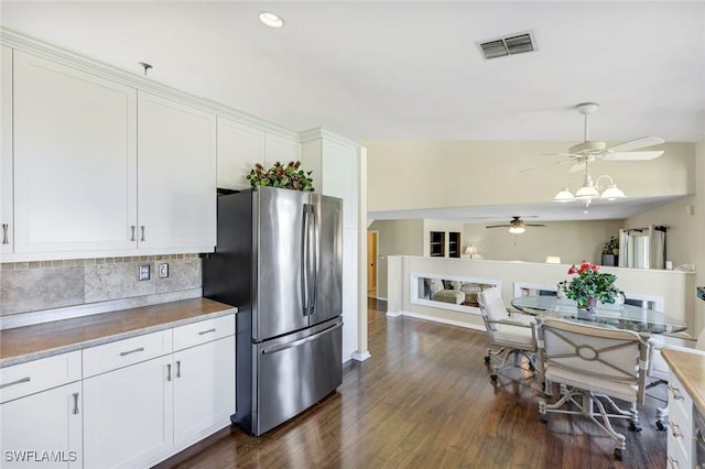 13760 Silver Lake Ct, Fort Myers, FL 33912 - kitchen with visible vents, freestanding refrigerator, dark wood-style flooring, ceiling fan, and tasteful backsplash