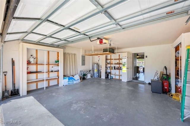13760 Silver Lake Ct, Fort Myers, FL 33912 - garage featuring water heater, a garage door opener, and electric panel