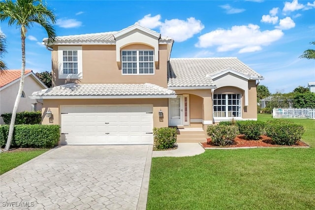 13760 Silver Lake Ct, Fort Myers, FL 33912 - mediterranean / spanish-style home featuring an attached garage, a front lawn, a tile roof, stucco siding, and concrete driveway