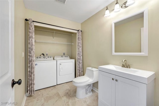 13760 Silver Lake Ct, Fort Myers, FL 33912 - bathroom featuring independent washer and dryer, toilet, baseboards, and vanity