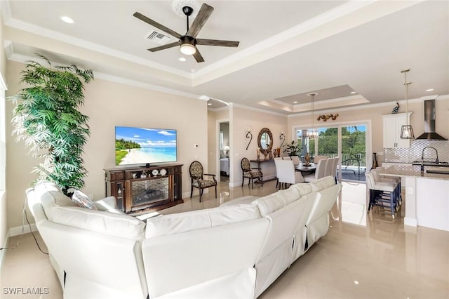 1978 San Marco Rd, Marco Island, FL 34145 - living room featuring a raised ceiling, a ceiling fan, ornamental molding, and recessed lighting