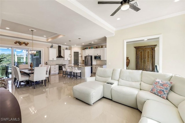 1978 San Marco Rd, Marco Island, FL 34145 - living area featuring crown molding, a ceiling fan, a chandelier, light marble finish flooring, and recessed lighting