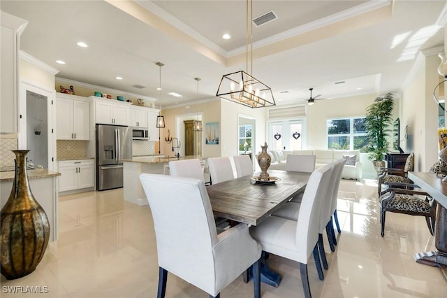 1978 San Marco Rd, Marco Island, FL 34145 - dining room with ornamental molding, recessed lighting, a ceiling fan, and a chandelier