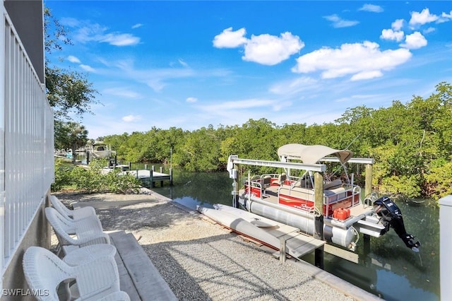 1978 San Marco Rd, Marco Island, FL 34145 - view of patio / terrace with a boat dock, a water view, and a forest view