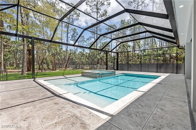 4693 13th Ave SW, Naples, FL 34116 - view of swimming pool featuring a pool with connected hot tub, a patio, and glass enclosure