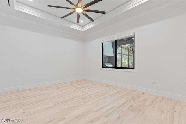 4693 13th Ave SW, Naples, FL 34116 - empty room with baseboards, a raised ceiling, crown molding, and wood finished floors