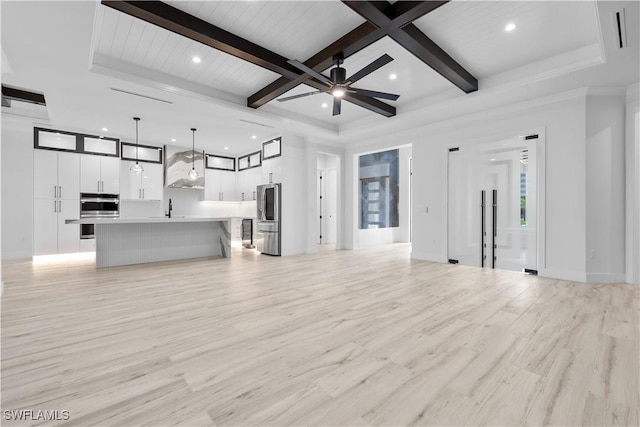 4693 13th Ave SW, Naples, FL 34116 - unfurnished living room featuring beamed ceiling, light wood finished floors, and recessed lighting
