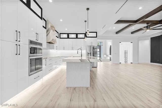 4693 13th Ave SW, Naples, FL 34116 - kitchen with a sink, stainless steel appliances, white cabinets, a kitchen island with sink, and modern cabinets