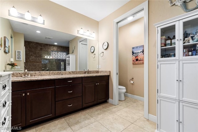 3824 SW 11th Pl, Cape Coral, FL 33914 - bathroom with a sink, tile patterned floors, toilet, and tiled shower