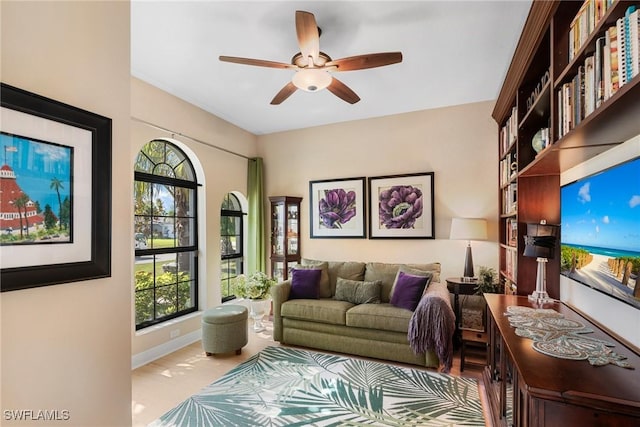 3824 SW 11th Pl, Cape Coral, FL 33914 - living room featuring ceiling fan, plenty of natural light, and baseboards