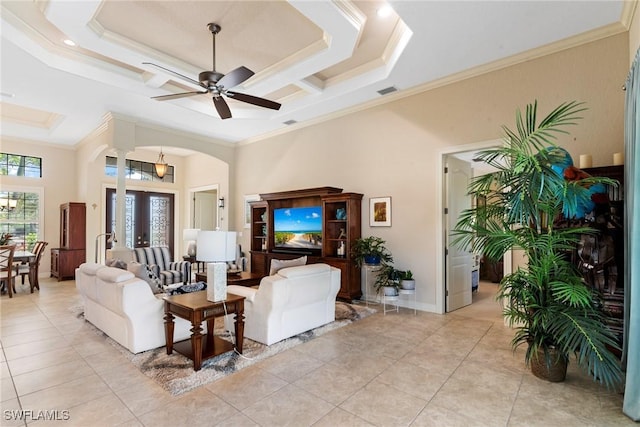 3824 SW 11th Pl, Cape Coral, FL 33914 - living room featuring light tile patterned floors, arched walkways, ornamental molding, and ceiling fan