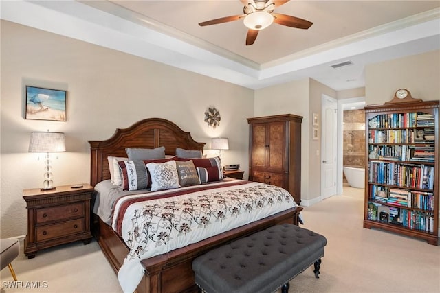 3824 SW 11th Pl, Cape Coral, FL 33914 - bedroom with a tray ceiling, ensuite bathroom, light colored carpet, and visible vents