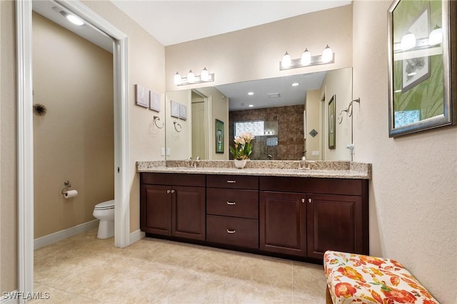 3824 SW 11th Pl, Cape Coral, FL 33914 - bathroom with double vanity, a sink, a tile shower, and toilet
