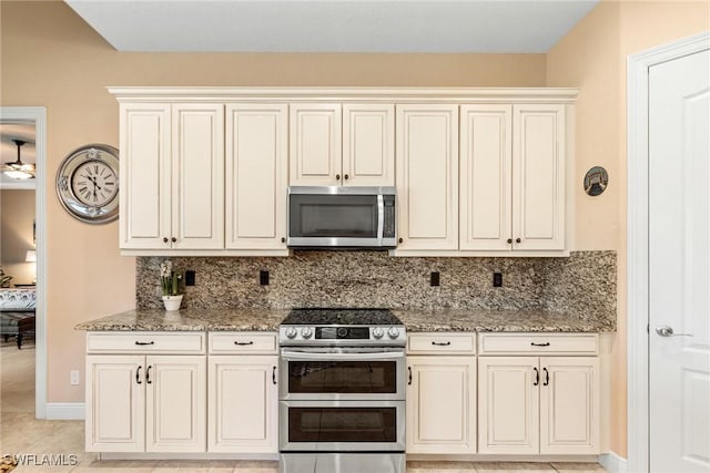3824 SW 11th Pl, Cape Coral, FL 33914 - kitchen featuring stone countertops, appliances with stainless steel finishes, and backsplash