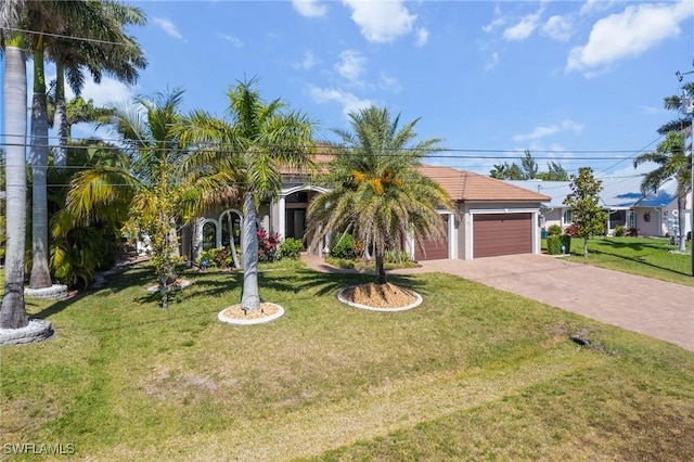 3824 SW 11th Pl, Cape Coral, FL 33914 - view of front of home with driveway, a garage, and a front lawn