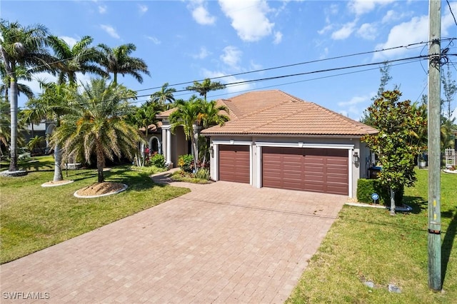 3824 SW 11th Pl, Cape Coral, FL 33914 - view of front facade with decorative driveway, a front yard, an attached garage, and a tile roof