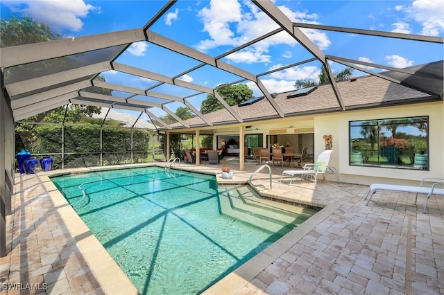 16902 Timberlakes Dr, Fort Myers, FL 33908 - swimming pool with a patio and glass enclosure