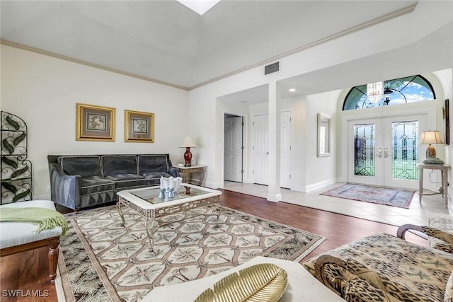 16902 Timberlakes Dr, Fort Myers, FL 33908 - living room featuring french doors, baseboards, ornamental molding, and wood finished floors