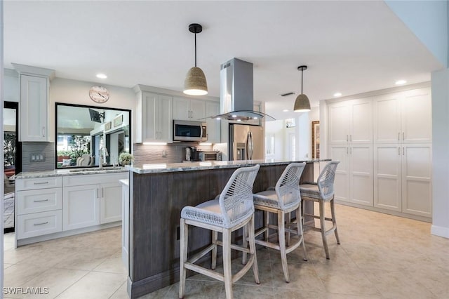 16902 Timberlakes Dr, Fort Myers, FL 33908 - kitchen with island exhaust hood, a sink, stainless steel appliances, tasteful backsplash, and recessed lighting